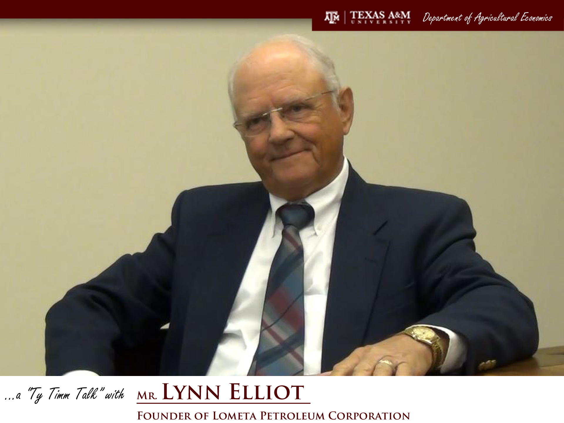 The words "a ty timm talk with Mr. Lynn Elliot - founder of Lometa Petroleum Corporation" run along the bottom. Mr. Elliot, wearing a dark blue suit, is seated at a table and facing slightly left.