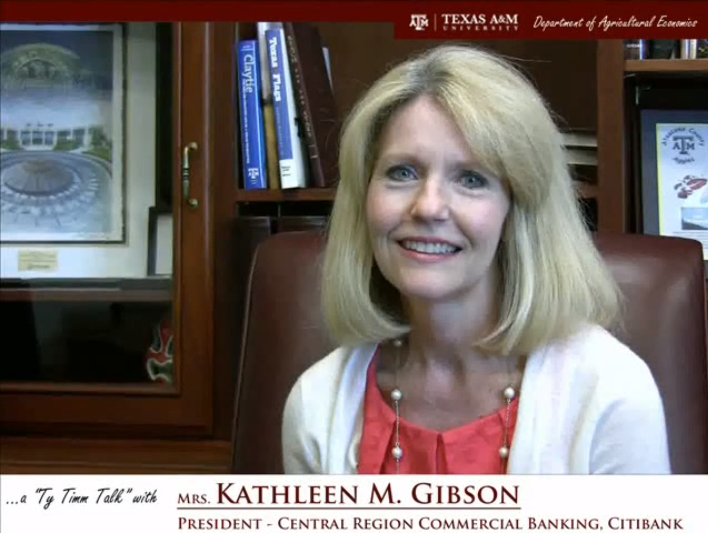 The words "a ty timm talk with Mrs. Kathleen M. Gibson - President - Central Region Commercial Banking CitiBank" run along the bottom. Mrs. GIbson, wearing a white sweater, is seated in a brown leather chair in front of a bookcase.