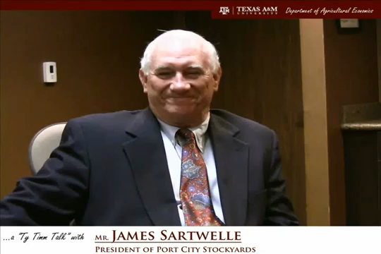 Thumbnail. The words "a ty timm talk with Mr. James Sartwelle - Presdient of port city stockyards" run along the bottom. Mr. Sartwelle  is seated and wearing a black suit, smiling. Click for interview.