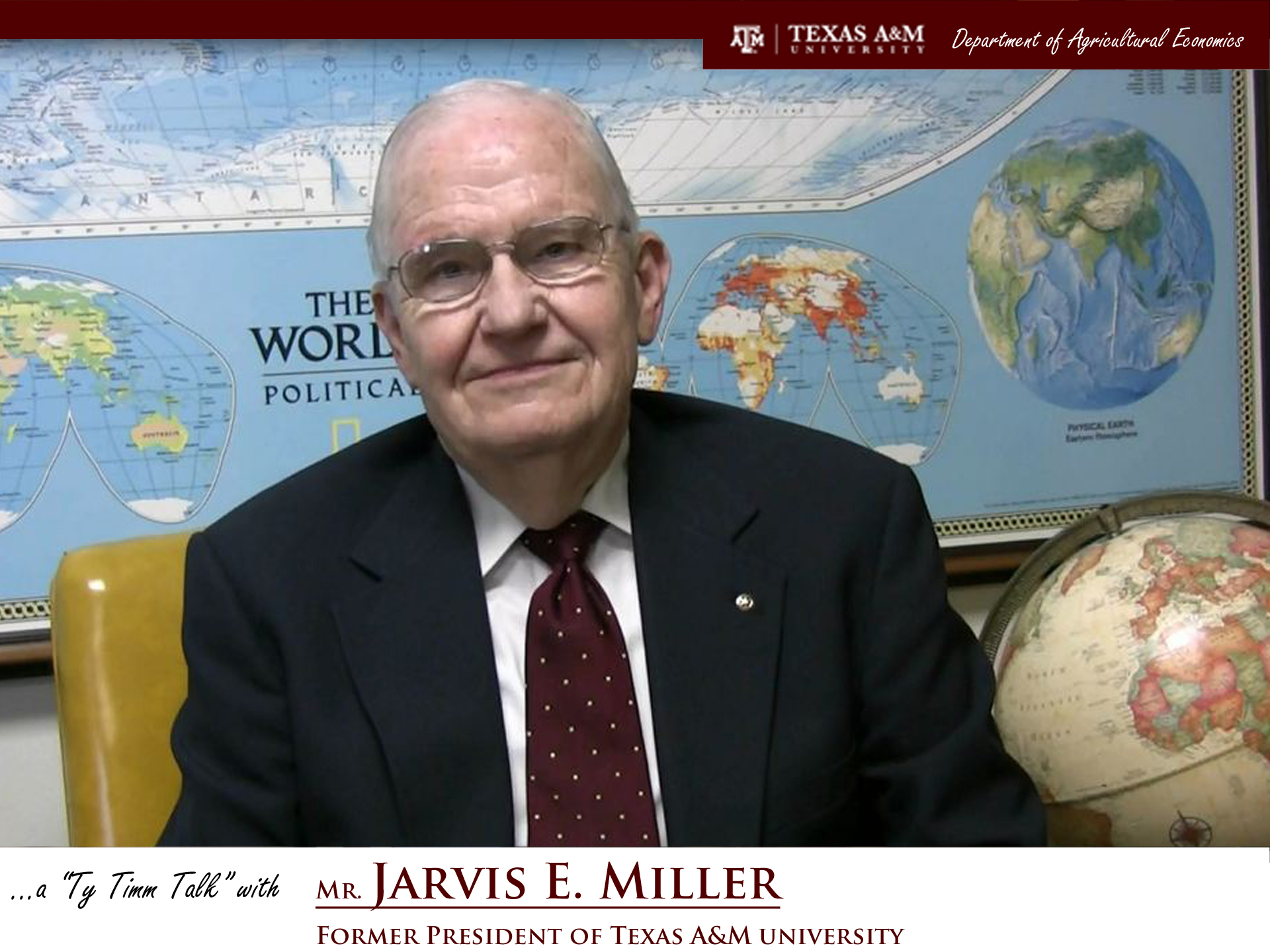 The words "a ty timm talk with Mr. Jarvis E. Miller - Former President of Texas A&M University" run along the bottom. Mr. Miller is seated and wearing a black suit, smiling in front of a map of the world.