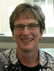 Roxanne Orsak smiling in a black and white patterned 