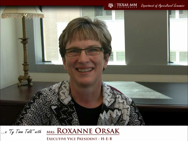 The words "a ty timm talk with Mrs. Roxanne Orsak - Executive Vice President - H-E-B" run along the bottom. Mrs. Orsak is seated and wearing a black-and-white patterned suit, smiling.