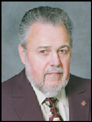 Stoney Stubbs Jr. in a grey suit against a grey backdrop