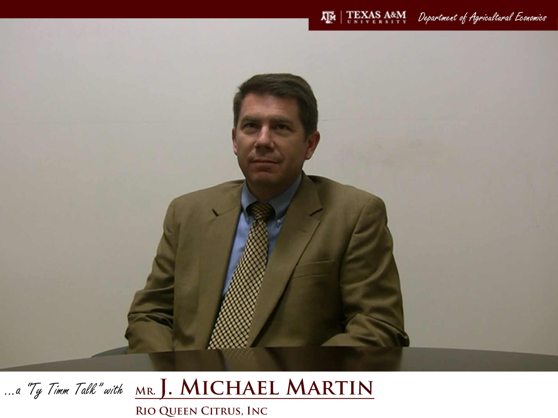 The words "a ty timm talk with Mr. J. Michael Martin - Rio Queen Citrus, Inc." run along the bottom. Mr. Martin is seated and wearing a grey suit, smiling.