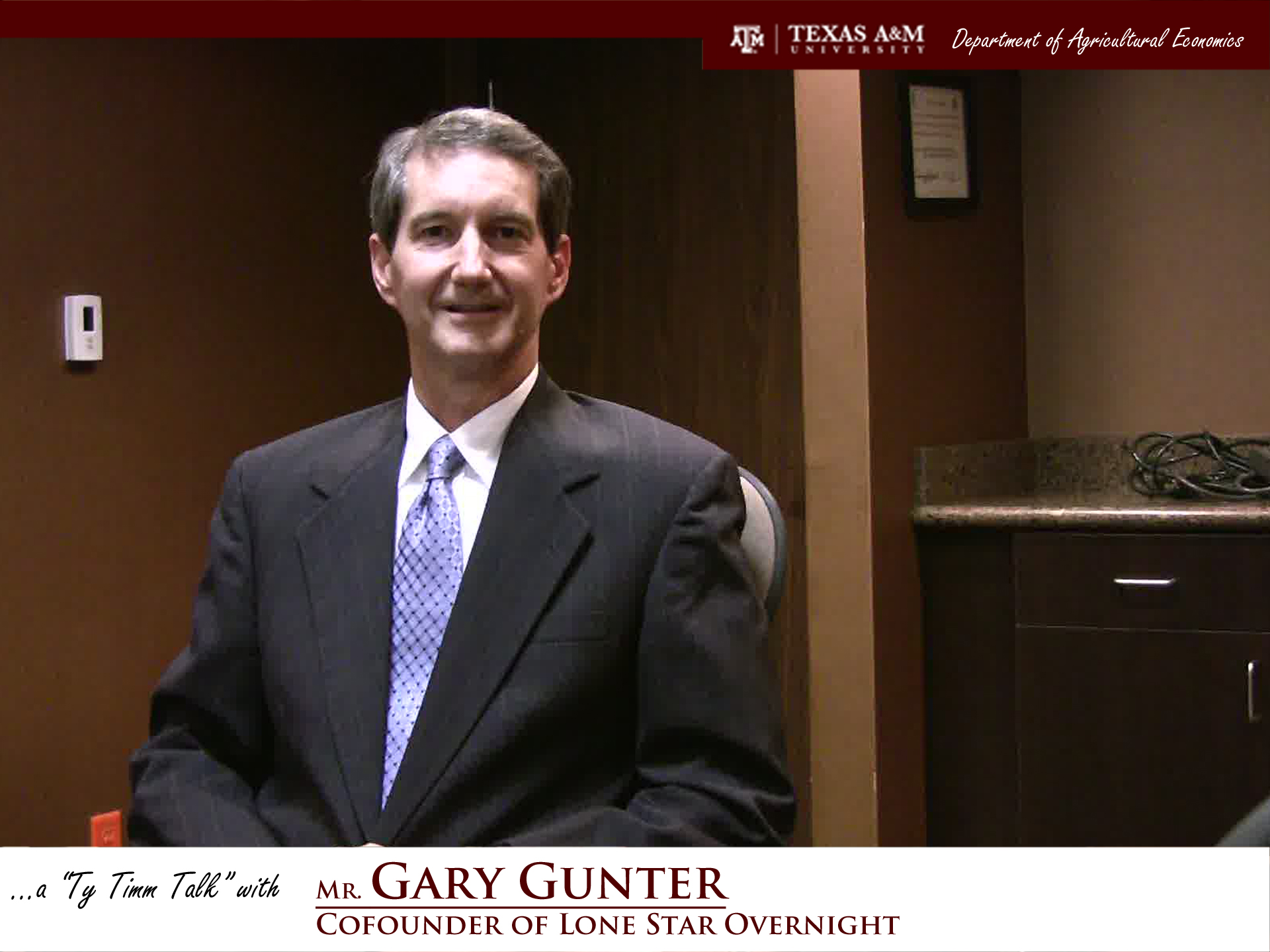 The words "a ty timm talk with Mr. Gary Gunter - Co founder of Lone Star Overnight" run along the bottom. Mr. Gunter is seated and wearing a black suit, smiling.